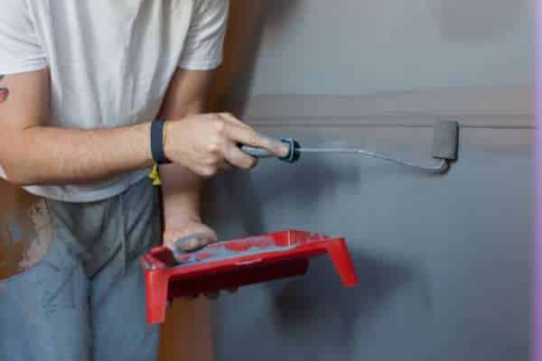 A close-up image of a freshly painted surface with a smooth, flawless finish, highlighting the importance of quality craftsmanship in painting.